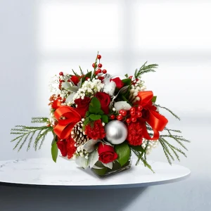 Christmas Flower Arrangement with red roses, carnations, and greenery