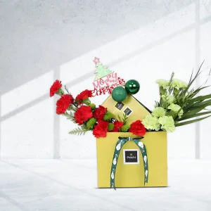 Merry Christmas flowers arrangement with chocolates